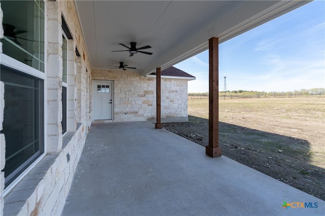 view of patio / terrace with a rural view