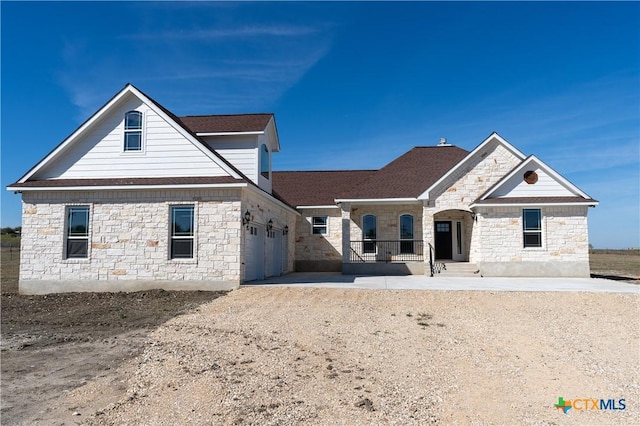 view of front of property with a garage