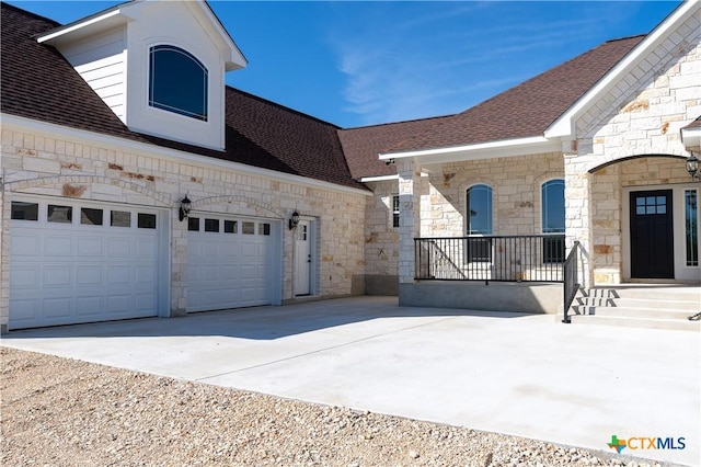 view of front of property with a garage