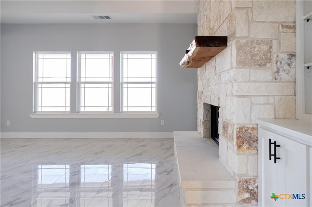 unfurnished living room featuring a fireplace