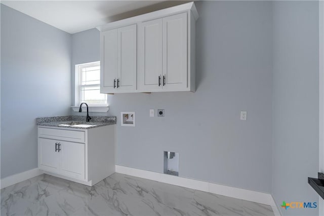 clothes washing area with cabinets, hookup for a washing machine, electric dryer hookup, and sink