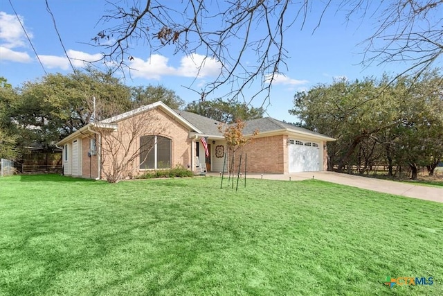 ranch-style house with a garage and a front lawn