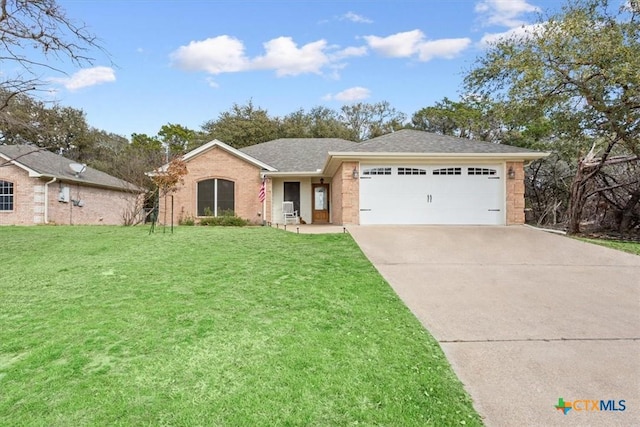 ranch-style house featuring a garage and a front yard