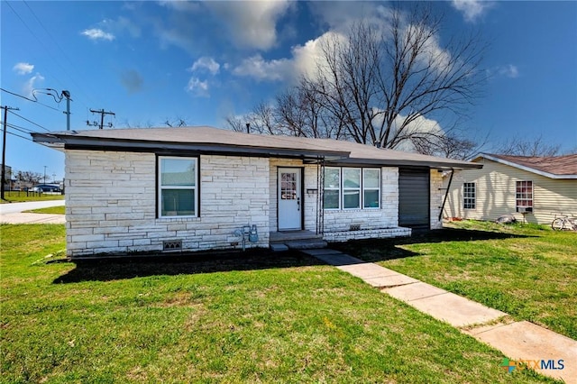 view of front of property with stone siding and a front lawn