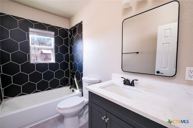 full bath with tile patterned flooring, toilet, vanity, and bathtub / shower combination
