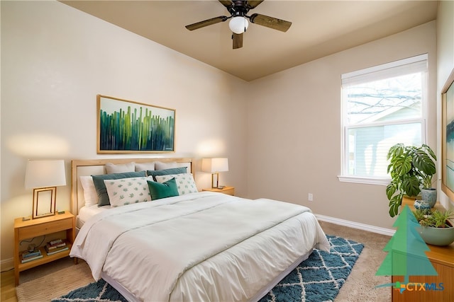 bedroom featuring a ceiling fan, baseboards, and carpet floors