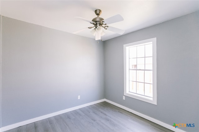 unfurnished room featuring hardwood / wood-style floors and ceiling fan