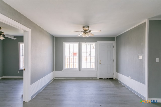 unfurnished room with hardwood / wood-style flooring and ceiling fan