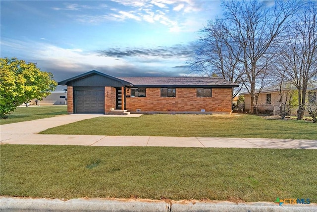 view of front of property featuring concrete driveway, brick siding, a front lawn, and an attached garage