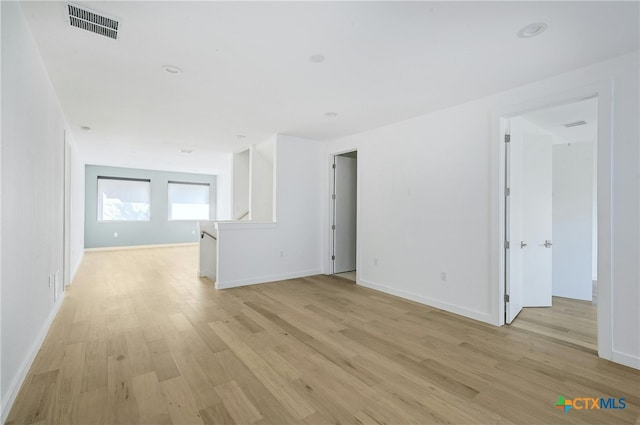 unfurnished room featuring light hardwood / wood-style floors