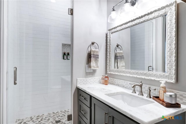 bathroom with vanity and walk in shower