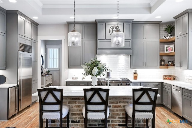 kitchen with stainless steel appliances and gray cabinetry