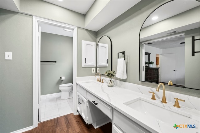 2711 Oak Leigh St, San Antonio, TX 78232 - bathroom featuring double vanity and wood finished floors