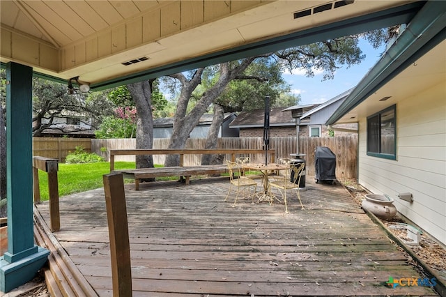 2711 Oak Leigh St, San Antonio, TX 78232 - wooden terrace with a fenced backyard, outdoor dining area, and a grill