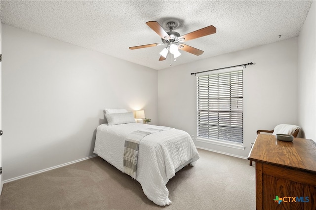 2711 Oak Leigh St, San Antonio, TX 78232 - carpeted bedroom featuring a ceiling fan and a textured ceiling