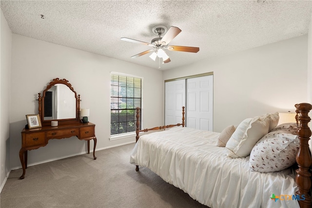 2711 Oak Leigh St, San Antonio, TX 78232 - carpeted bedroom with a closet, ceiling fan, and a textured ceiling