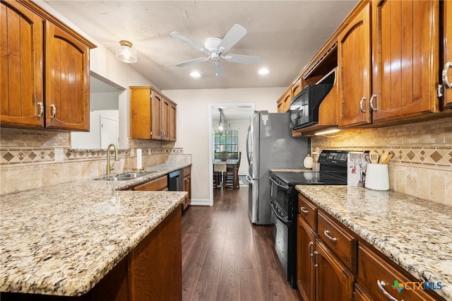 2711 Oak Leigh St, San Antonio, TX 78232 - kitchen with black appliances, tasteful backsplash, ceiling fan, brown cabinetry, and recessed lighting