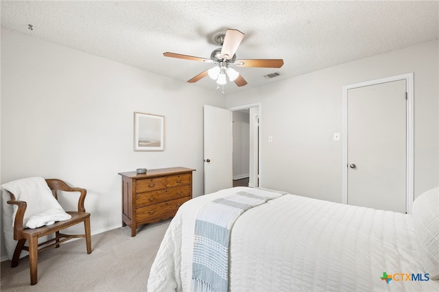 2711 Oak Leigh St, San Antonio, TX 78232 - bedroom featuring light carpet, a textured ceiling, and a ceiling fan