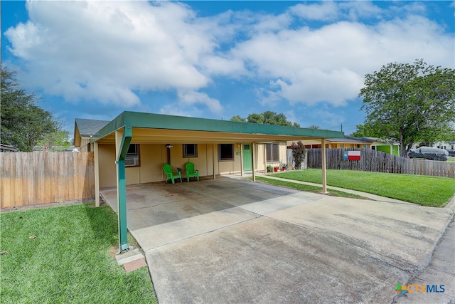 single story home with a front yard and a carport