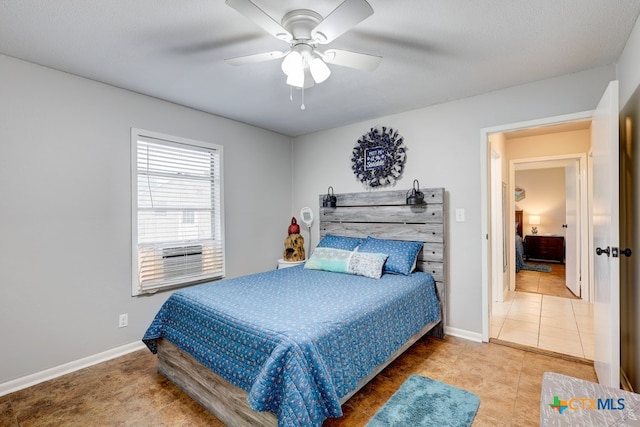 bedroom with tile patterned floors and ceiling fan