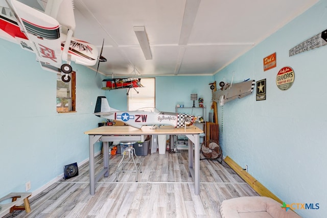 miscellaneous room featuring wood-type flooring