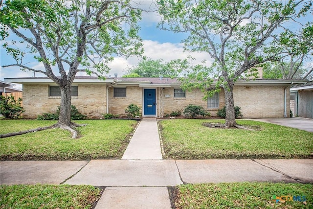 ranch-style home with brick siding and a front yard