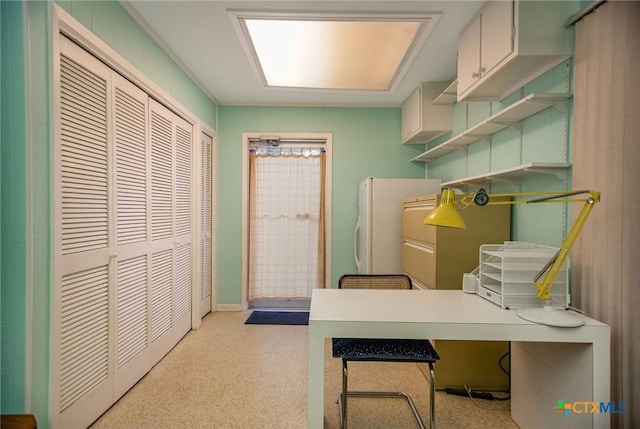 home office with light speckled floor