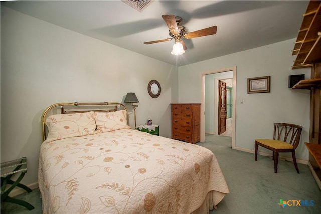 carpeted bedroom with baseboards, ceiling fan, and visible vents