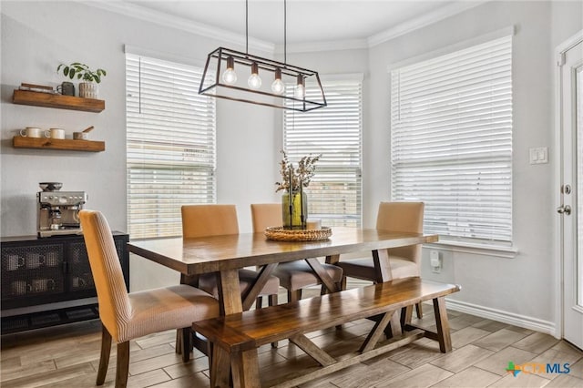 2516 Arno St, Harker Heights, TX 76548 - dining room featuring a chandelier, wood tiled floors, and crown molding