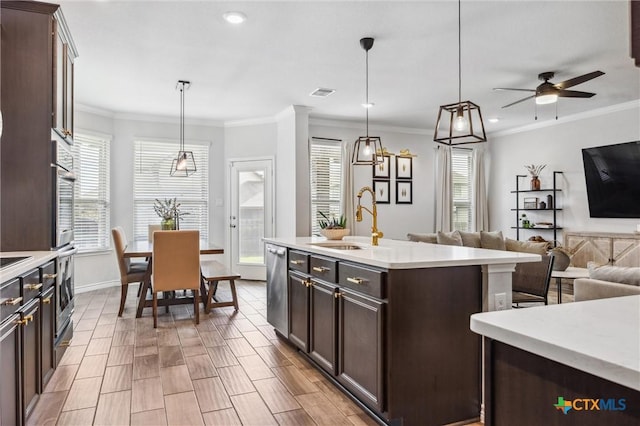 2516 Arno St, Harker Heights, TX 76548 - kitchen with dishwasher, open floor plan, plenty of natural light, light countertops, and ornamental molding