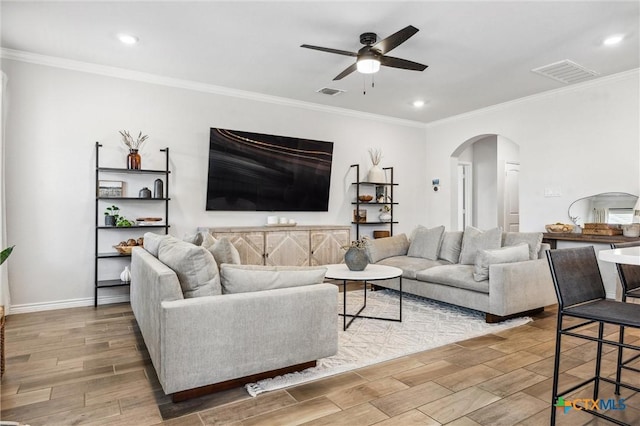 2516 Arno St, Harker Heights, TX 76548 - living area featuring arched walkways, ceiling fan, wood finished floors, recessed lighting, and ornamental molding