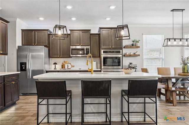 2516 Arno St, Harker Heights, TX 76548 - kitchen featuring appliances with stainless steel finishes, ornamental molding, dark brown cabinets, light countertops, and decorative backsplash