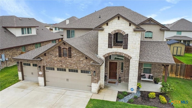 2516 Arno St, Harker Heights, TX 76548 - french country inspired facade featuring stone siding, a shingled roof, a garage, and driveway
