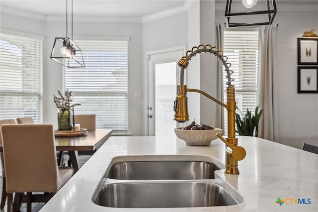 2516 Arno St, Harker Heights, TX 76548 - kitchen with crown molding, hanging light fixtures, and light countertops