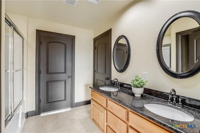 bathroom with vanity and tile patterned floors