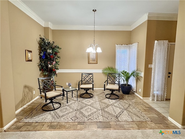 sitting room with crown molding, baseboards, and a chandelier