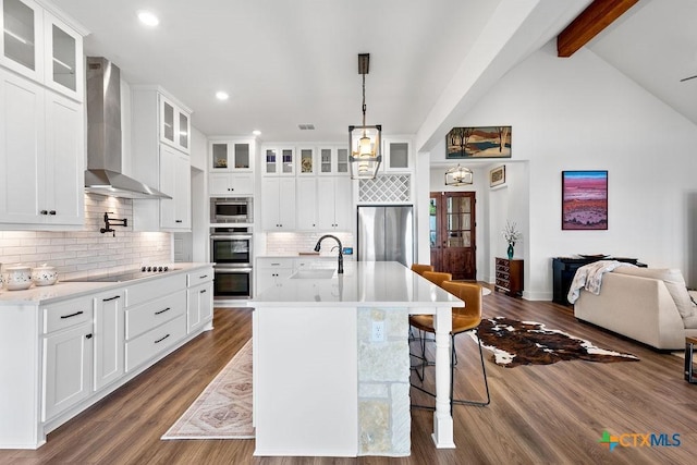 213 Lets Roll Dr, Fischer, TX 78623 - kitchen featuring wall chimney exhaust hood, appliances with stainless steel finishes, a sink, recessed lighting, and light countertops