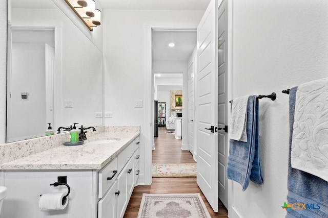 213 Lets Roll Dr, Fischer, TX 78623 - bathroom with vanity and wood finished floors
