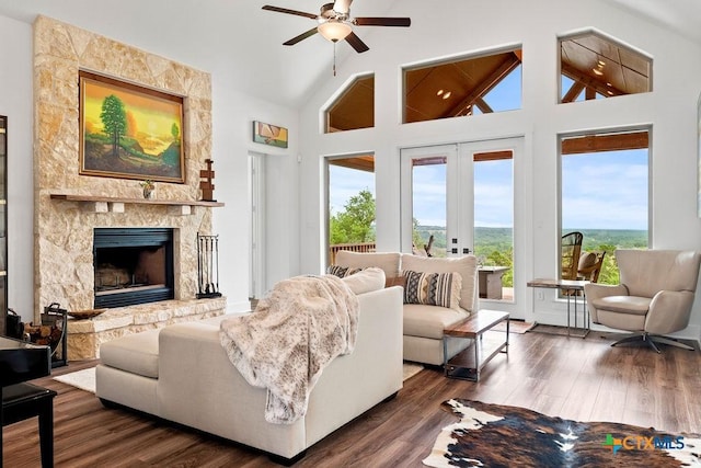 213 Lets Roll Dr, Fischer, TX 78623 - living area with ceiling fan, a premium fireplace, high vaulted ceiling, dark wood-style flooring, and french doors