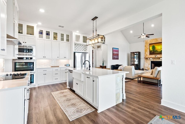 213 Lets Roll Dr, Fischer, TX 78623 - kitchen with a sink, stainless steel appliances, ceiling fan, light countertops, and backsplash