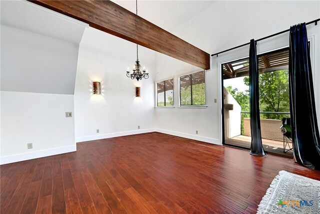 unfurnished living room featuring dark hardwood / wood-style floors, vaulted ceiling with beams, and a notable chandelier