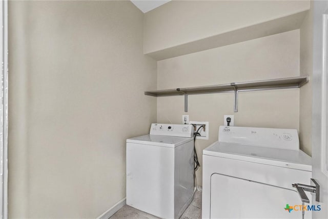 washroom featuring laundry area, independent washer and dryer, and baseboards