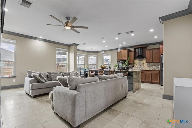 living area with ornamental molding, recessed lighting, visible vents, and a ceiling fan