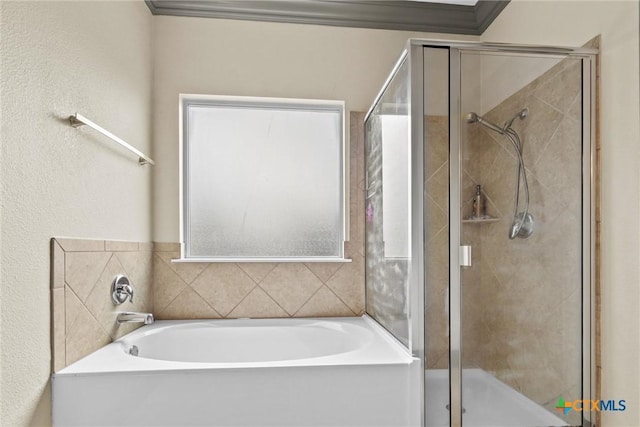 full bathroom with crown molding, a shower stall, and a bath