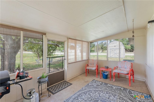 sunroom / solarium featuring vaulted ceiling