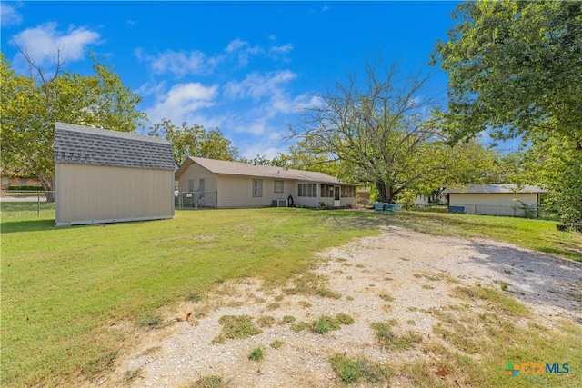 view of yard featuring a storage unit