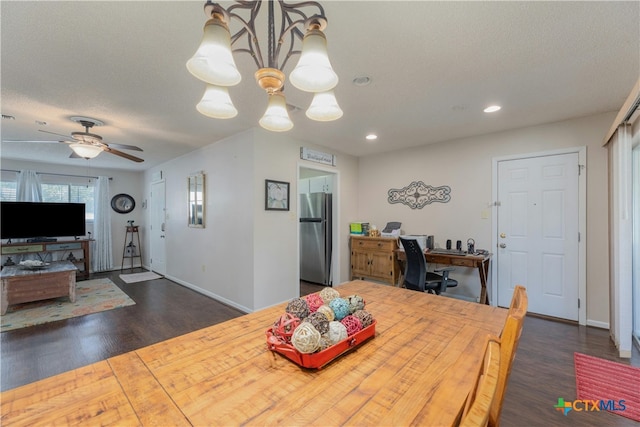 dining room featuring dark hardwood / wood-style floors, a textured ceiling, and ceiling fan with notable chandelier