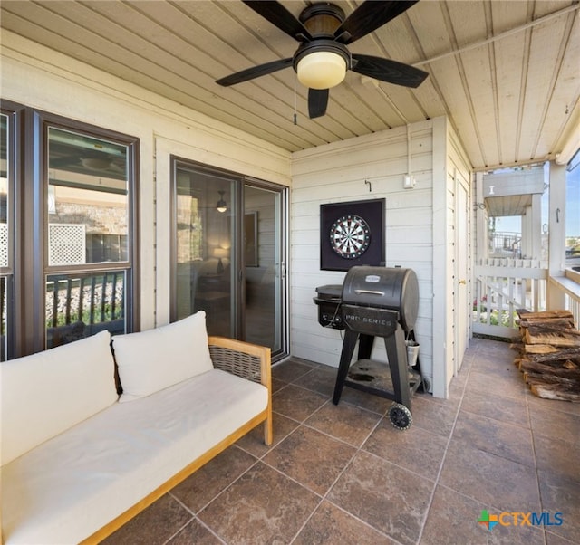 view of patio with grilling area and a ceiling fan