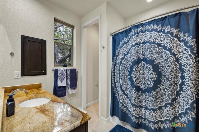 2919 Colleen Dr, Canyon Lake, TX 78133 - bathroom with curtained shower, baseboards, vanity, and tile patterned flooring