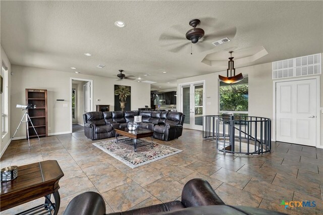2919 Colleen Dr, Canyon Lake, TX 78133 - living area featuring a ceiling fan, visible vents, and a textured ceiling